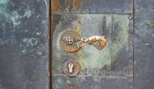 Close up of a metal door with a lock
