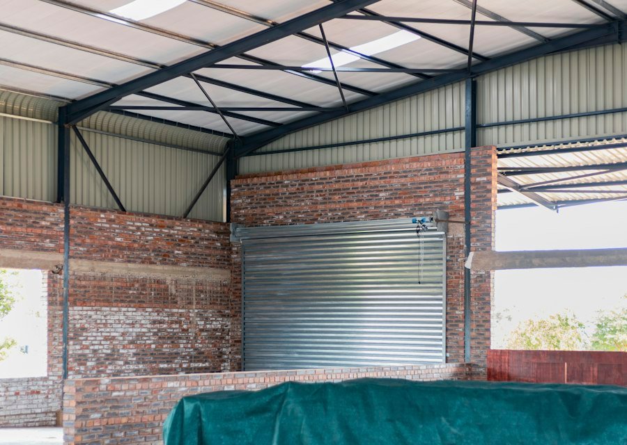 Metal roll-up door in a brick wall